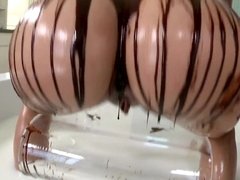 Blonde covers herself and her man in chocolate. She eats cum as well