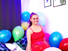 Balloon popping teaser shows her big naturals as well