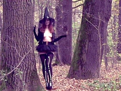 Sassy witch flaunts her perky assets in the woods