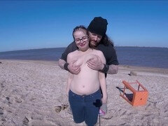 Adorable teen enjoys beach breeze while revealing it all