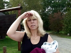 Outdoors screwing for a busty GILF by a young blond man